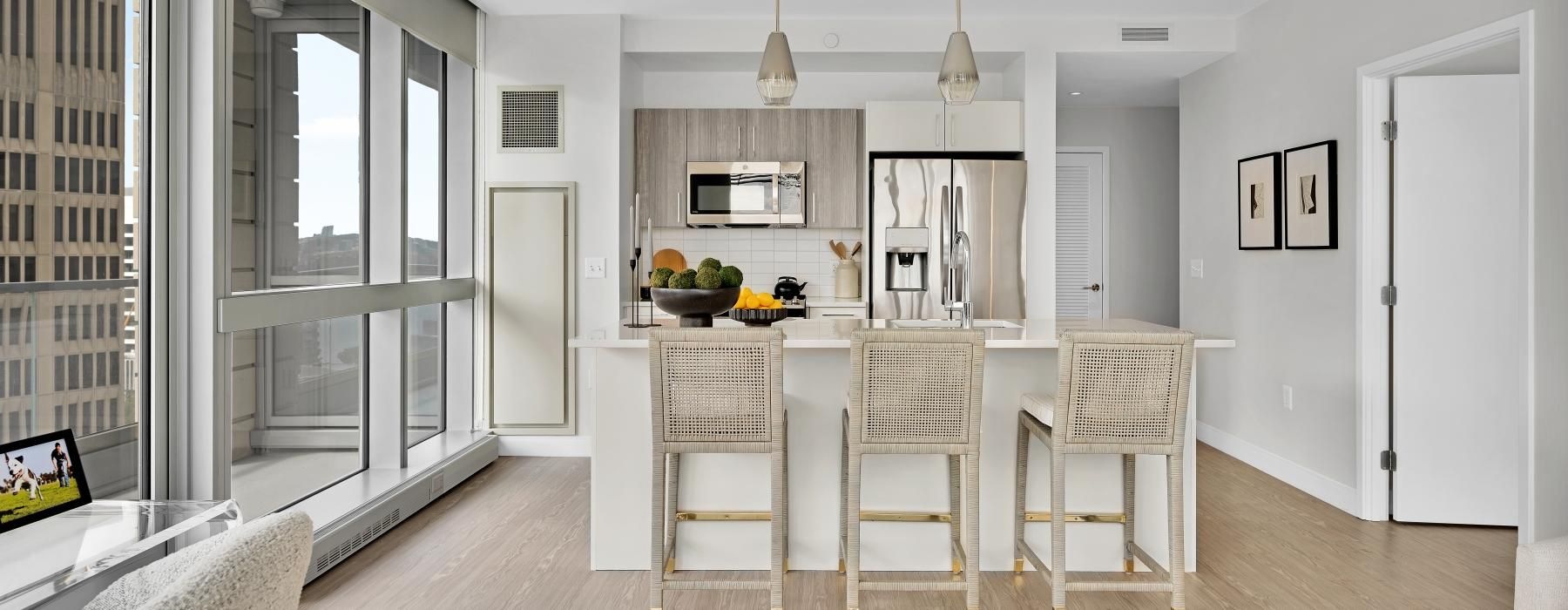 a kitchen with a dining table and chairs