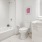 a bathroom with a shower and toilet