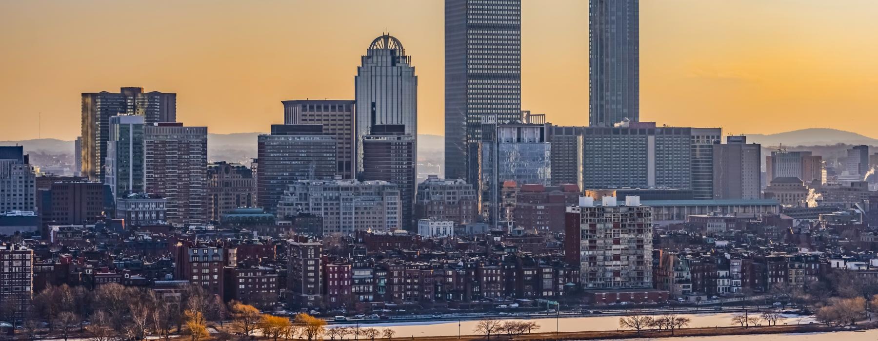 a city skyline with a river