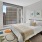 a bedroom with a large window
