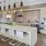 a kitchen with a marble island